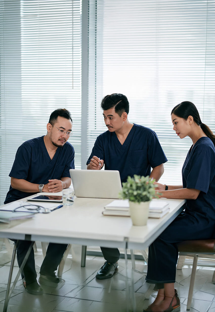 Multidisciplinary care team discussing a patient's treatment plan
