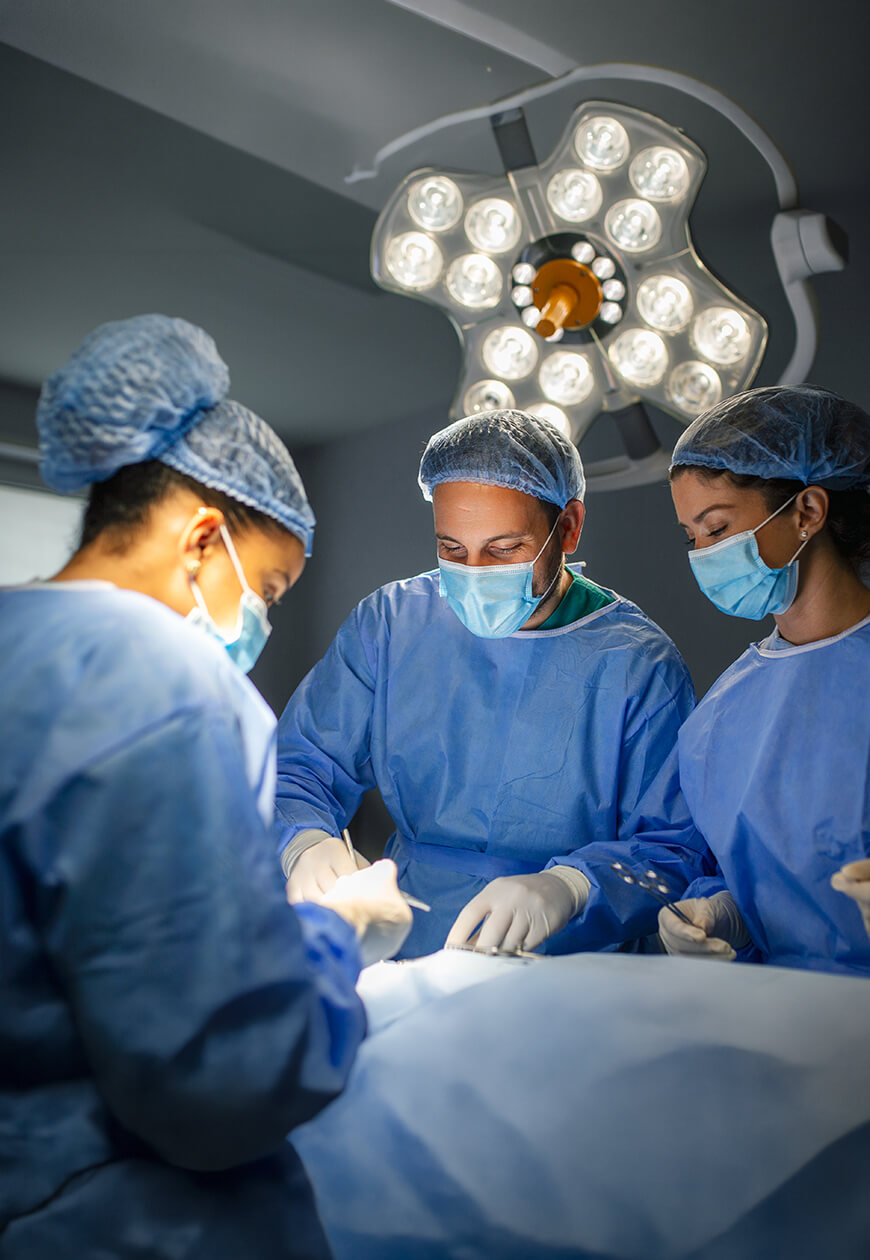 Surgeon reviewing an ultrasound scan of a patient's neck